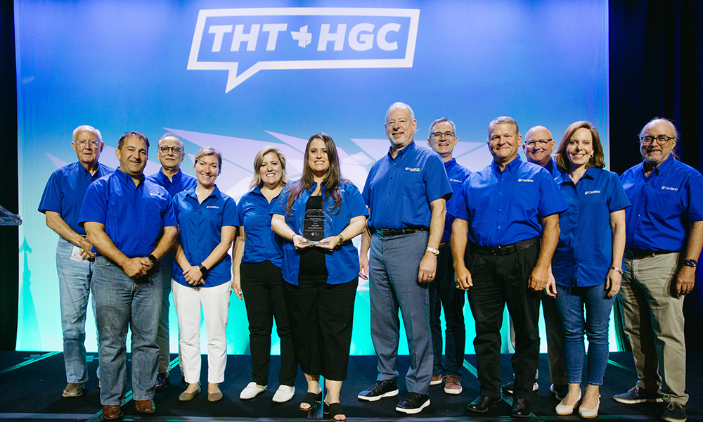 Ashley Bellow 2024 winner of the Ollie Jo Bozeman Excellence in Administrative Professionalism Award poses with her team